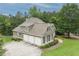 Stunning home featuring an attached three car garage and meticulously manicured lawn at 414 Wallis Farm Way, Marietta, GA 30064