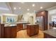 Modern kitchen with an island, stainless steel appliances, and ample counter space, perfect for culinary enthusiasts at 414 Wallis Farm Way, Marietta, GA 30064