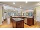 Gourmet kitchen boasts stainless appliances, granite counters, and a breakfast bar, ideal for casual dining at 414 Wallis Farm Way, Marietta, GA 30064