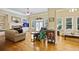 Spacious living room featuring hardwood floors, a fireplace, and plenty of natural light at 414 Wallis Farm Way, Marietta, GA 30064