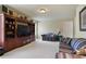 Large living room featuring a TV and built-in shelving units and two sofas at 414 Wallis Farm Way, Marietta, GA 30064