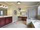 Luxurious main bathroom with a soaking tub, separate shower, and double vanities, perfect for spa-like experience at 414 Wallis Farm Way, Marietta, GA 30064