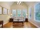 Bright sitting room with hardwood floors, multiple windows, and a comfortable sofa at 414 Wallis Farm Way, Marietta, GA 30064