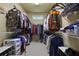 Organized walk-in closet with ample shelving and hanging space, designed for optimal storage and accessibility at 414 Wallis Farm Way, Marietta, GA 30064