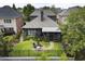 Aerial view showcasing a home's manicured backyard and screened in porch at 570 Society St, Alpharetta, GA 30022