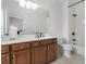 Bright bathroom features a single sink vanity, a tub with shower and tiled walls at 570 Society St, Alpharetta, GA 30022