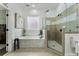 Luxurious bathroom featuring a soaking tub, frameless shower, and elegant tile work at 570 Society St, Alpharetta, GA 30022