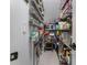 A well-organized pantry boasts multiple shelves for ample storage of food, spices and small appliances at 570 Society St, Alpharetta, GA 30022