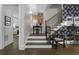 Inviting staircase with decorative wallpaper, wood steps, and stylish decor create a welcoming entrance at 570 Society St, Alpharetta, GA 30022