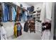 Well-organized walk-in closet with ample shelving and hanging space for clothing and accessories at 570 Society St, Alpharetta, GA 30022
