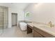 Bathroom featuring a glass-enclosed shower, soaking tub, and dual vanity sinks at 675 Crest Line Trl, Powder Springs, GA 30127