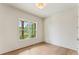 Cozy bedroom featuring a large window with scenic views and neutral wall paint at 675 Crest Line Trl, Powder Springs, GA 30127