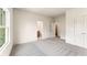 Spacious bedroom with soft carpet, large windows, and natural light at 675 Crest Line Trl, Powder Springs, GA 30127