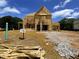 Two-story home under construction featuring wood framing on a sunny day at 675 Crest Line Trl, Powder Springs, GA 30127