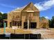 Two-story home under construction featuring wood framing and exposed beams at 675 Crest Line Trl, Powder Springs, GA 30127