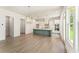 Modern kitchen with a center island, pendant lighting, stainless steel appliances, and sleek cabinetry at 675 Crest Line Trl, Powder Springs, GA 30127