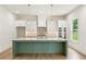 Beautiful kitchen featuring a large island, modern pendant lights, and stainless steel appliances at 675 Crest Line Trl, Powder Springs, GA 30127