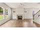 Bright living room with a fireplace, hardwood floors, and large windows at 675 Crest Line Trl, Powder Springs, GA 30127
