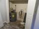 Storage room featuring a hot water heater, electric panel, and room for storage at 1993 Whitehall Forest Ct, Atlanta, GA 30316