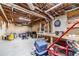 Unfinished basement with concrete floor, exposed ceiling; potential for customization and added living space at 3040 Sandy Creek Ct, Loganville, GA 30052