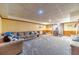 Finished basement featuring a fireplace, a sofa, and carpeting at 3040 Sandy Creek Ct, Loganville, GA 30052