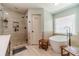Elegant bathroom boasts a soaking tub, walk-in shower, and modern fixtures for a spa-like experience at 3040 Sandy Creek Ct, Loganville, GA 30052