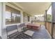 Relax on the covered deck with seating, offering a serene view of the lush surroundings and neighborhood at 3040 Sandy Creek Ct, Loganville, GA 30052