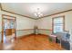 Traditional dining room featuring hardwood floors, crown molding, and natural light, ready for your personal touch at 3040 Sandy Creek Ct, Loganville, GA 30052
