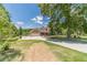 A charming house with a large lawn, covered porch, three-car garage, and ample parking space at 3040 Sandy Creek Ct, Loganville, GA 30052