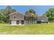 Back of the house with a two-story deck, showcasing the outdoor living space and well-maintained lawn at 3040 Sandy Creek Ct, Loganville, GA 30052