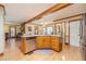 Spacious kitchen with center island, stainless steel appliances, and wood cabinetry at 3040 Sandy Creek Ct, Loganville, GA 30052