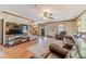 Inviting living room with a cozy seating arrangement, wood flooring, and natural light at 3040 Sandy Creek Ct, Loganville, GA 30052