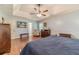 This airy main bedroom, bathed in natural light, features hardwood floors and a tranquil atmosphere at 3040 Sandy Creek Ct, Loganville, GA 30052