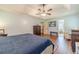 A serene main bedroom with a view to the ensuite bathroom and a well-appointed layout offers tranquility at 3040 Sandy Creek Ct, Loganville, GA 30052