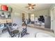 Sunroom featuring an exercise bike, storage, and a glass door at 3040 Sandy Creek Ct, Loganville, GA 30052