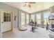 Sunroom featuring ample natural light and an exercise bike at 3040 Sandy Creek Ct, Loganville, GA 30052