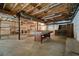 Unfinished basement with exposed ceiling, shelving, and ample storage space at 3310 Bryan Way, Marietta, GA 30008
