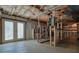 Large unfinished basement with double doors leading outside and shelves at 3310 Bryan Way, Marietta, GA 30008