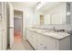Bright bathroom with double vanity, marble countertop, and large mirror at 3310 Bryan Way, Marietta, GA 30008