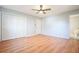 Hardwood bedroom with ceiling fan and access to the ensuite bathroom at 3310 Bryan Way, Marietta, GA 30008