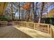 Spacious wooden deck perfect for outdoor gatherings with fenced in backyard and mature trees at 3310 Bryan Way, Marietta, GA 30008