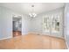 Dining area features hardwood floors, a chandelier, and doors leading to the exterior at 3310 Bryan Way, Marietta, GA 30008