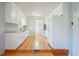 Kitchen with white cabinets, granite countertops, and stainless steel appliances open to living area at 3310 Bryan Way, Marietta, GA 30008