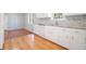 Bright kitchen featuring white cabinets, granite countertops, and a stainless steel sink at 3310 Bryan Way, Marietta, GA 30008