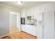 Kitchen features white cabinets, sleek appliances, and ample countertop space at 3310 Bryan Way, Marietta, GA 30008