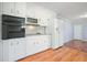 Kitchen features white cabinets, sleek appliances, and ample countertop space at 3310 Bryan Way, Marietta, GA 30008