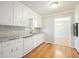 Kitchen featuring white cabinets, granite countertops, and a stainless steel sink at 3310 Bryan Way, Marietta, GA 30008