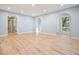 Bright living room featuring hardwood floors, recessed lighting, and arched doorways to other rooms at 3310 Bryan Way, Marietta, GA 30008
