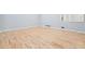 Spacious room with hardwood floors and a freshly painted neutral color palette at 3310 Bryan Way, Marietta, GA 30008
