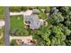 Bird's eye view of estate with meticulously landscaped grounds, including manicured lawn, gardens, and mature trees at 4119 Alayna Lee Cir, Mcdonough, GA 30252